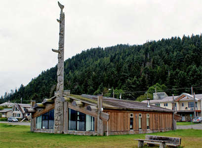Skidegate totem pole and building