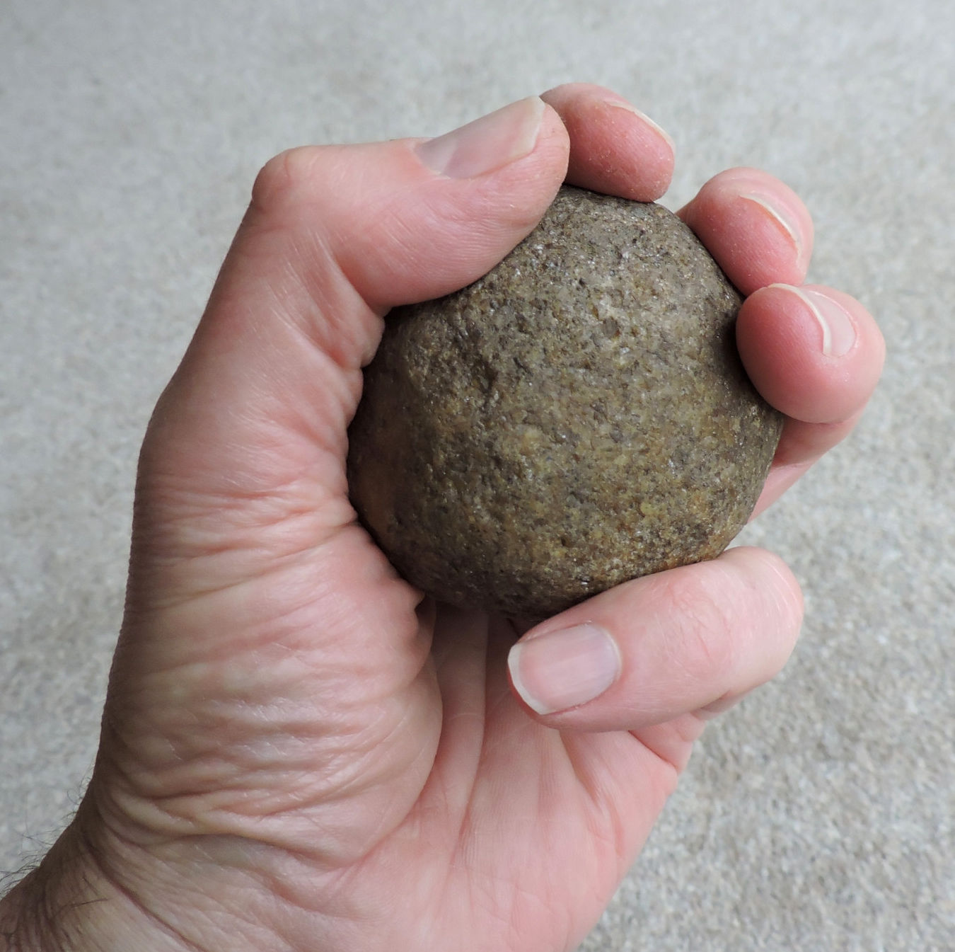 First stone. Rounded Stone.